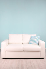 White sofa in room on blue background