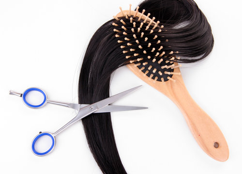 Long Black Hair With Hairbrush And Scissors Isolated On White