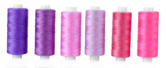 Colored spools of threads isolated on white