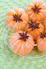 Ripe sweet tangerines, on color background