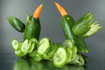 Carving vegetable pattern of hummingbirds on grey background