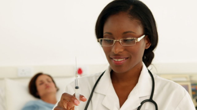 Nurse preparing an injection