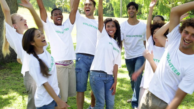 Group of volunteers putting their hands together