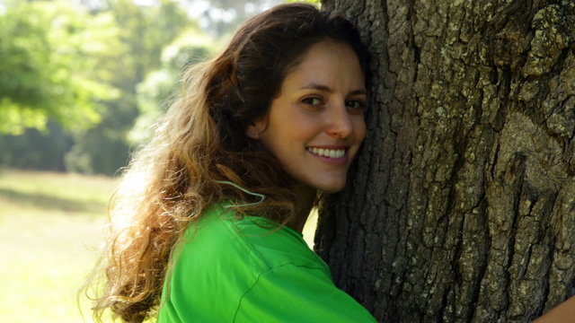 Environmental activist hugging a tree