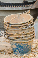Plastic buckets for transport of cement at construction site