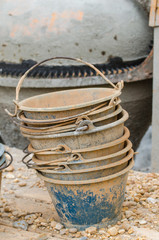 Fototapeta premium Plastic buckets for transport of cement at construction site