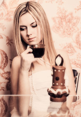 portrait of  beautiful girl with cup of coffee and chocolate can