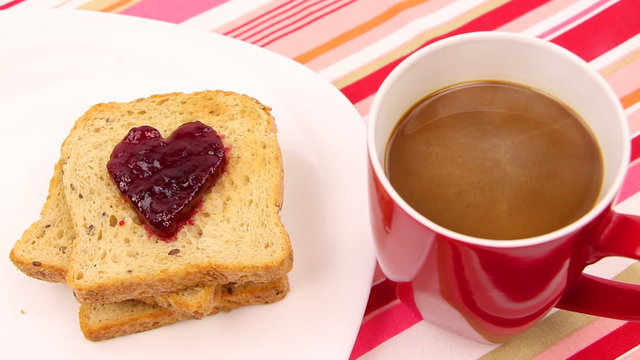 A breakfast scene with a heart of red jam. Be my valentine