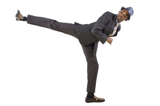 young black businessman doing a karate kick
