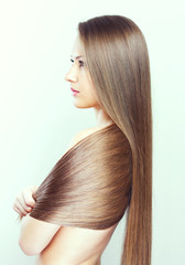 Obraz premium Beautiful Woman with Healthy Long Hair