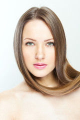 Fototapeta premium closeup portrait of a beautiful young woman with elegant long sh