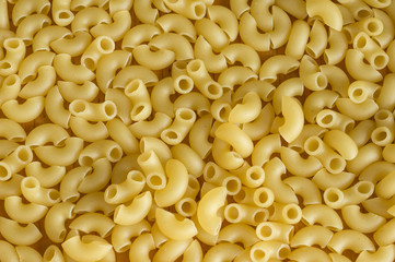 Background from scattered pasta close up