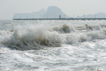 Sea wave on a windy day .