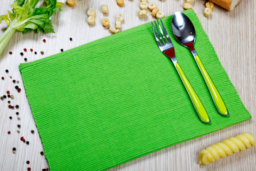 green napkin with flatware