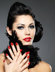 Woman with red nails and creative hairstyle