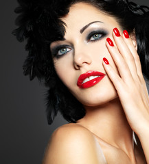 Woman with red nails and creative hairstyle