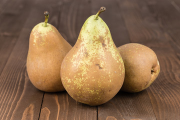 Pears on a rustic wooden table