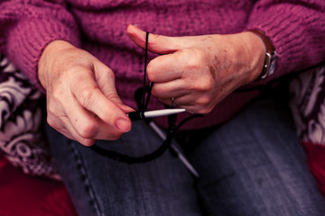 Old woman knitting