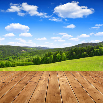 Wooden table in the spring landscape