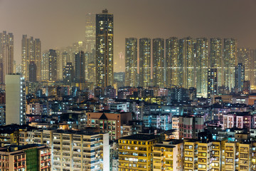 Fototapeta na wymiar Residential building in Hong Kong at night