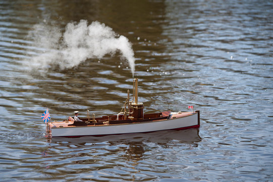 Model ship is left on a lake to water