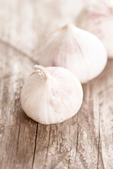 Garlic on wooden table two