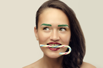 Woman eating one lollipop