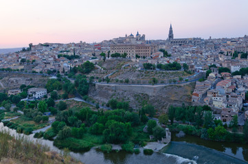 Fototapeta premium The historic city of Toledo at dusk in Spain