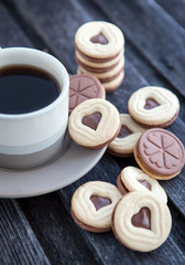 Cup of coffee and heart shaped cut out cookies