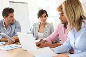Fototapeta premium Young business people in a meeting
