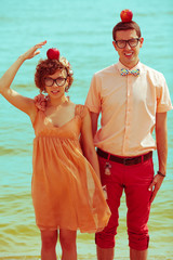 Nerds' honeymoon concept. Couple of funny hipsters