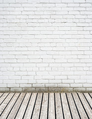 white brick wall and wooden floor