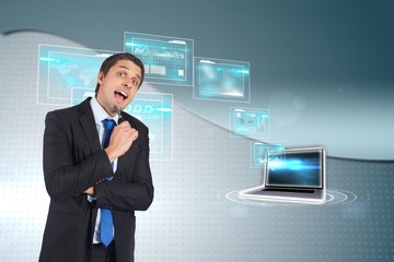 Composite image of thinking businessman holding pen