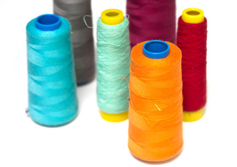 Colorful bobbins isolated on white