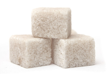 Cubes of sugar on the white background