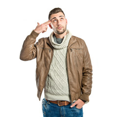 Young man committing suicide over white background