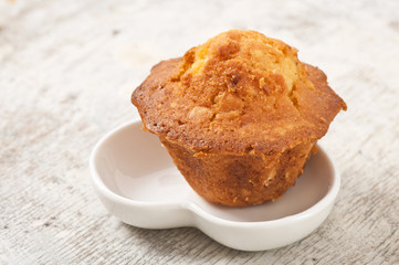 delicious cupcake on the old wooden background