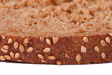 brown crust of bread sprinkled with sesame seeds isolated