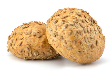 Round sandwich bun with sunflower seeds isolated on white backgr