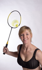 Badminton player hitting shuttlecock