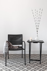 Home decor. Armchair and table with decorations