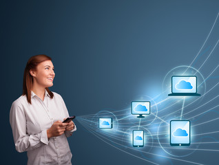 Pretty lady typing on smartphone with cloud computing