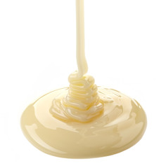 pouring condensed milk on a white background