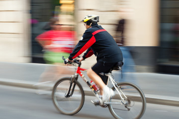 Cyclist on the city roadway. Rome, Italy