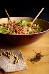 Big bowl of fresh vegetable salad with chickpeas and cumin