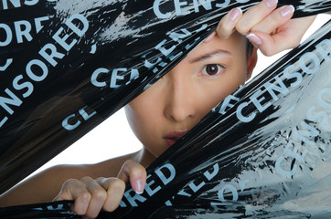 East woman peeking in the gap