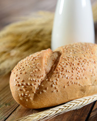 Bread and milk on wooden background