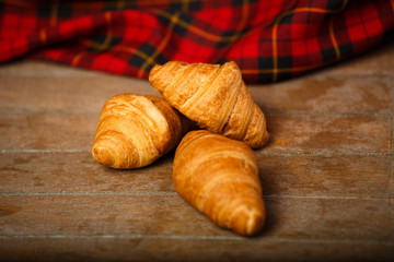 Three croissants at table