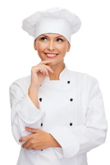 smiling female chef dreaming