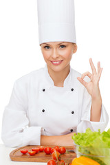 female chef with vagetables showing ok sign